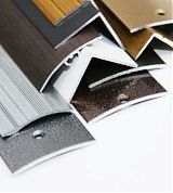Алюминиевые  пороги для ламината линолеума ковролина паркетной доски,стыки и порожки,профили для плитки и напольных покрытий.